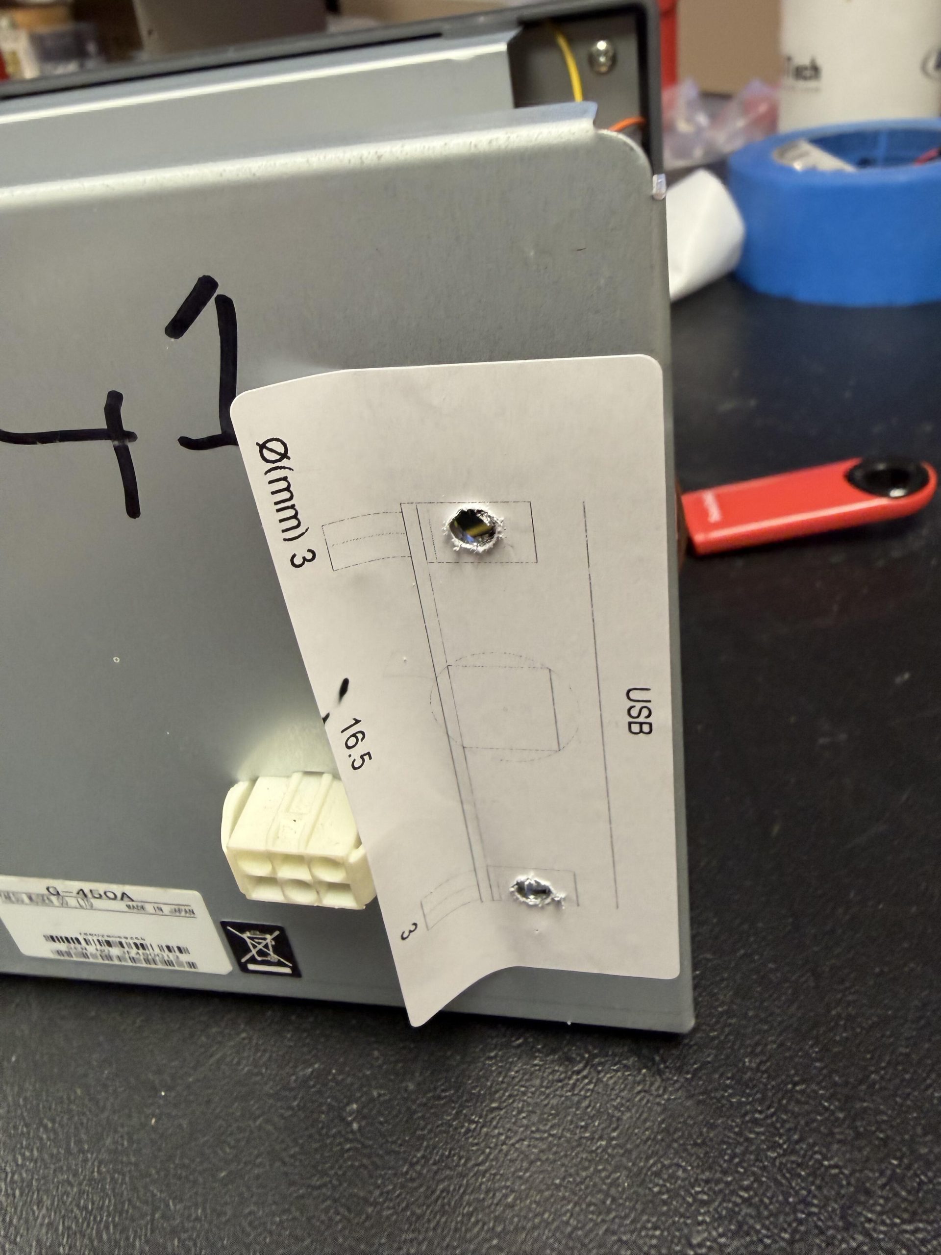 Drilling template with measurements for the USB cutout on the rotator case