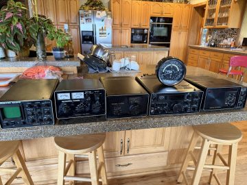 The complete Yaesu 301 line on the kitchen counter, world clock on top
